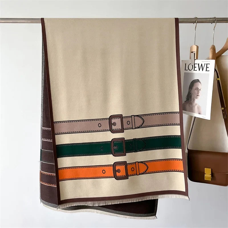 Elegant cashmere blend scarf for unisex wear, showcasing a sophisticated belt & buckle print. Soft & warm.