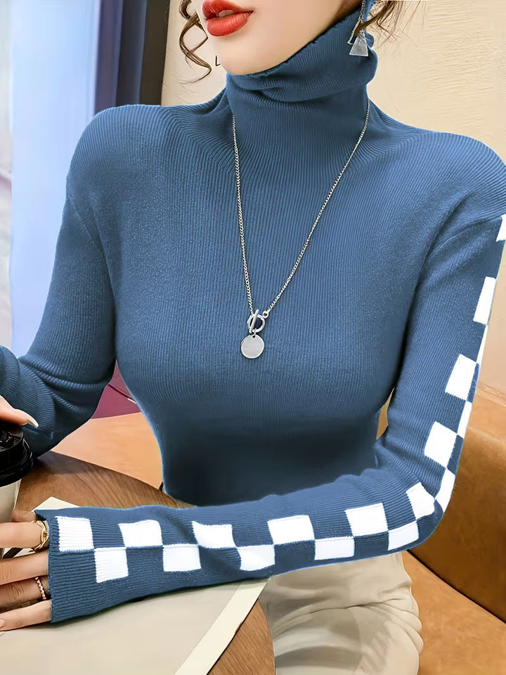 Comfortable unisex high-neck sweater with unique checkerboard sleeves. Perfect for layering.
