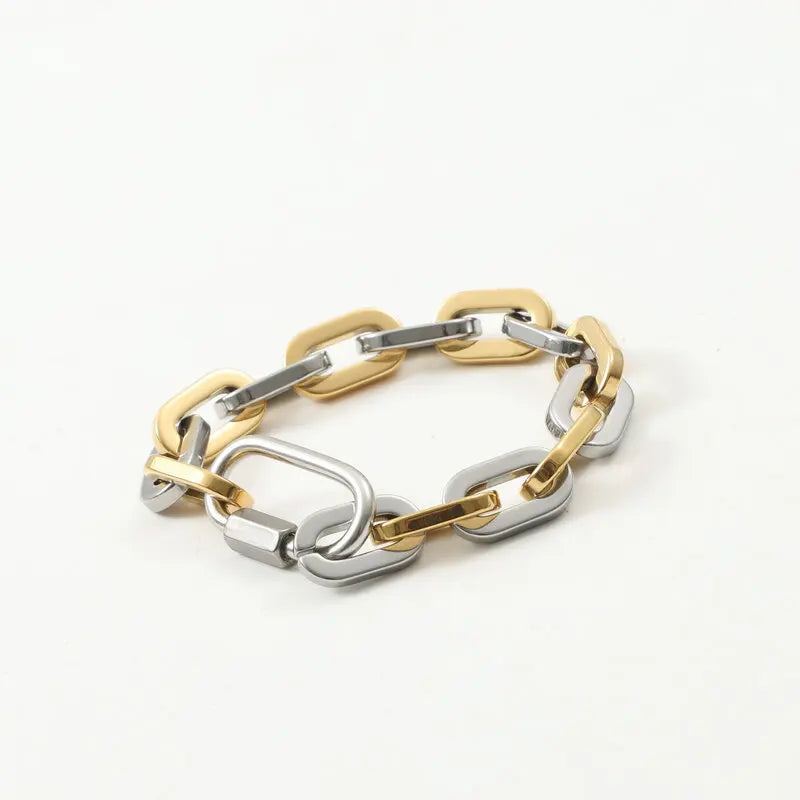 Unisex chunky two-tone gold-plated bracelet with durable stainless steel and modern carabiner clasp. Statement jewelry.