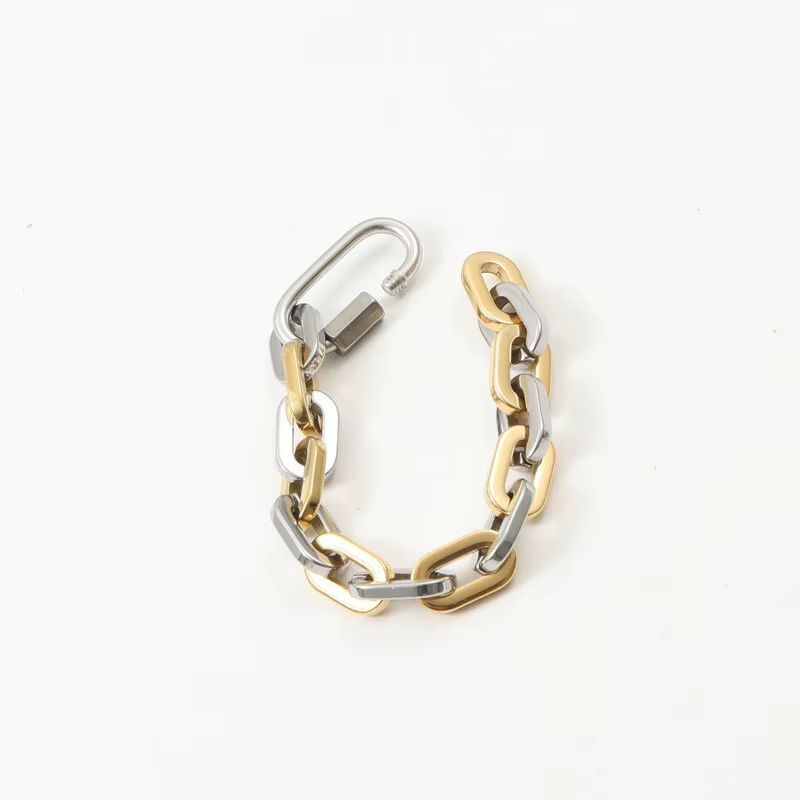 Durable unisex chunky two-tone gold-plated bracelet. Modern stainless steel with a unique carabiner clasp.