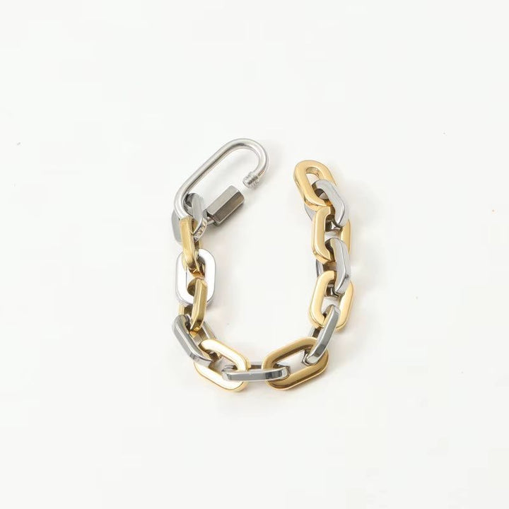 Durable unisex chunky two-tone gold-plated bracelet. Modern stainless steel with a unique carabiner clasp.
