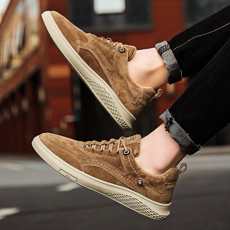 Front view of classic grey suede unisex sneakers, ready for everyday adventures.