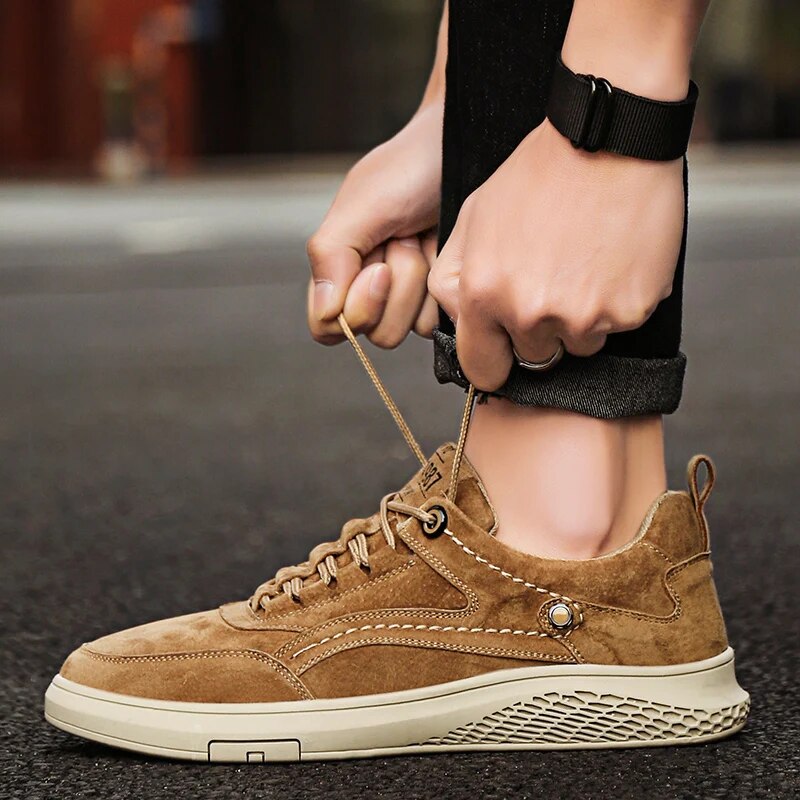 Suede casual sneakers with a classic silhouette, providing all-day comfort for unisex wear.