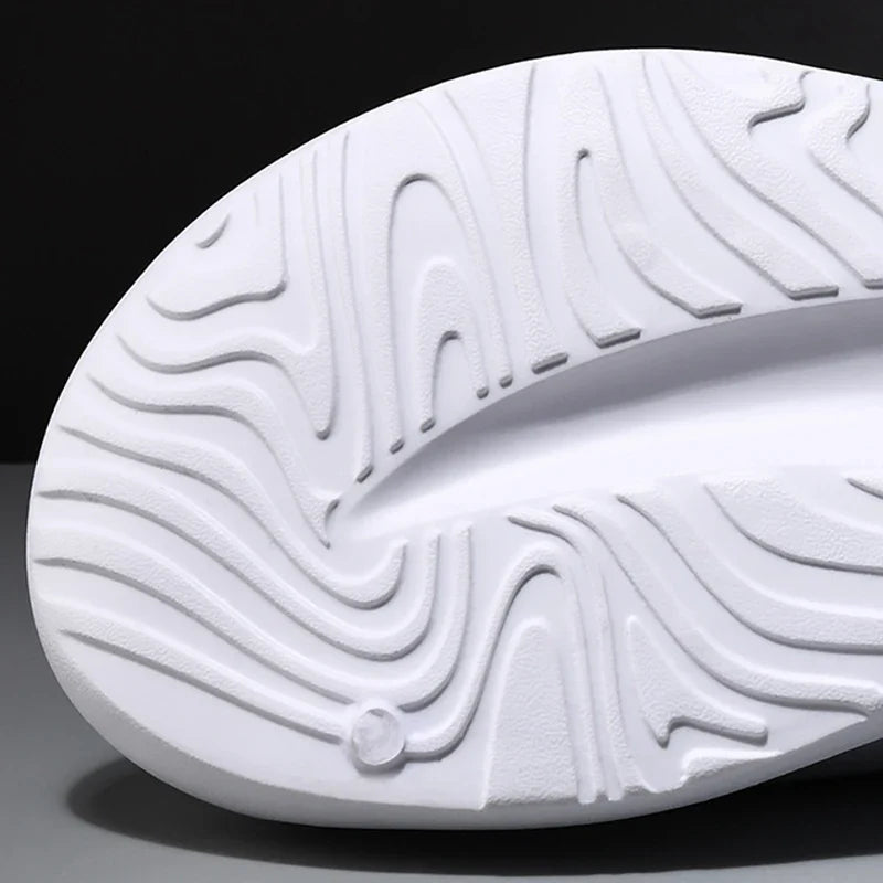 Modern unisex foam slides with cloud-like cushioning, designed for comfort and lightweight everyday wear.