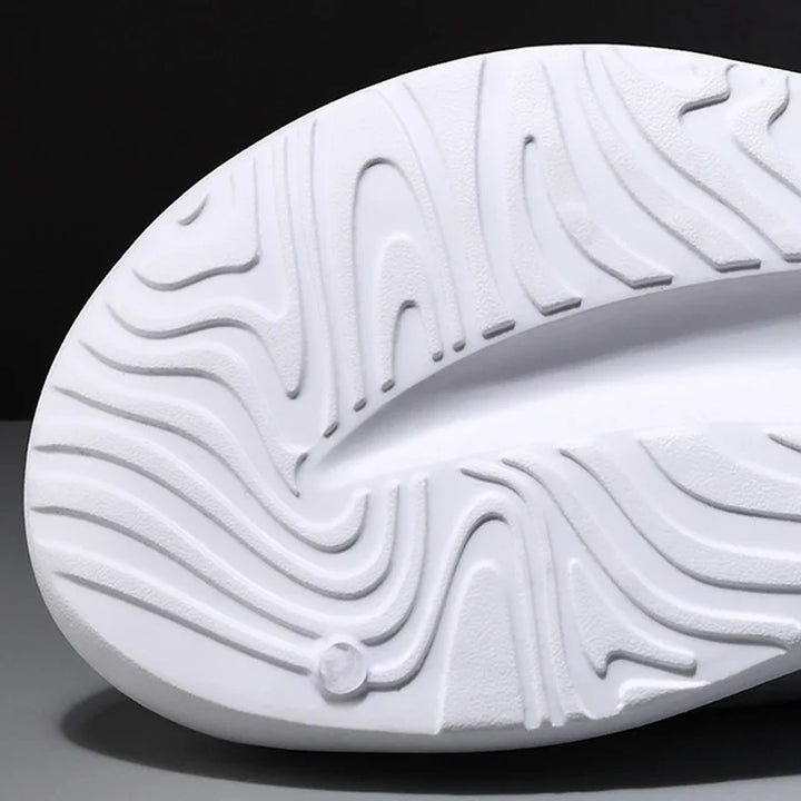 Modern unisex foam slides with cloud-like cushioning, designed for comfort and lightweight everyday wear.