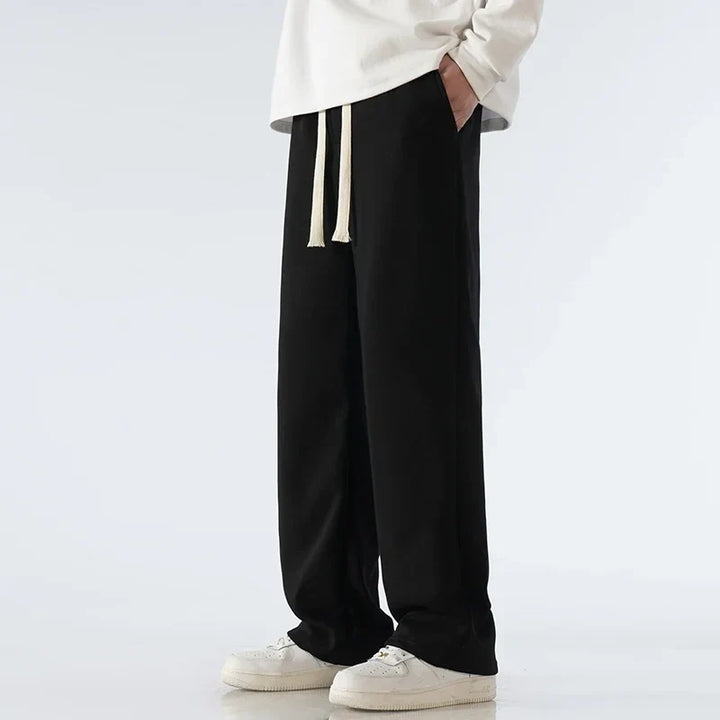 Versatile unisex wide-leg sweatpants. Cloud Comfort design, adjustable waist, great for athleisure & lounging.