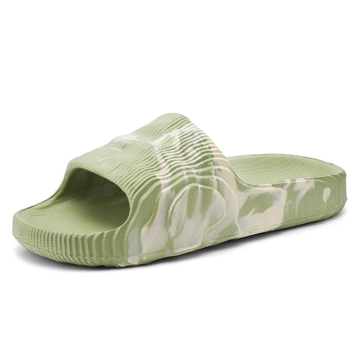 Cloud-soft cushioned Rio slides for unisex comfort. Lightweight, marbled design, perfect casual summer sandals.