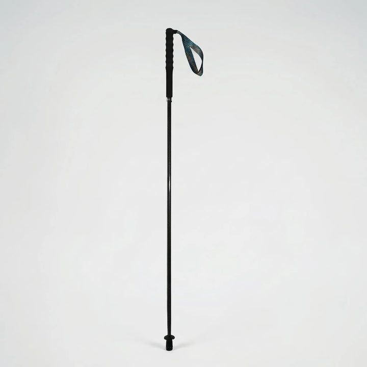 Ergonomic grip of a lightweight carbon fiber trekking pole, designed for comfortable and secure hold on hikes.