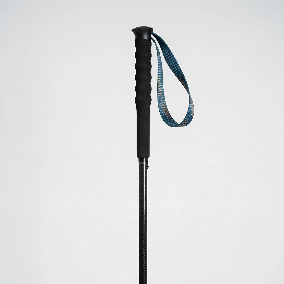 Pair of unisex collapsible carbon fiber hiking poles. Essential lightweight outdoor gear for any adventure.