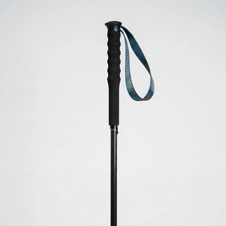Pair of unisex collapsible carbon fiber hiking poles. Essential lightweight outdoor gear for any adventure.
