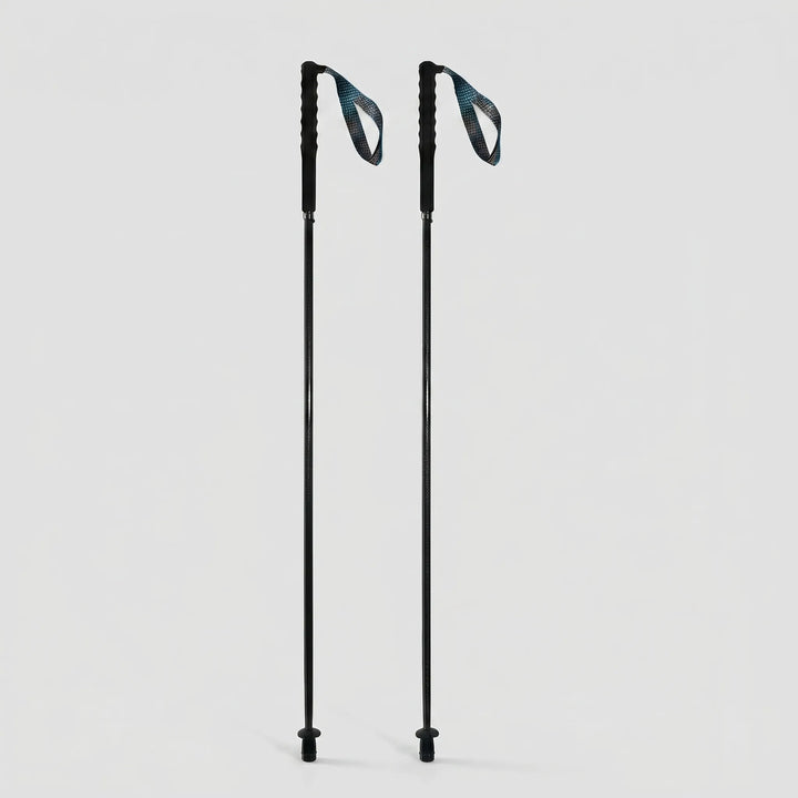 Collapsible carbon fiber trekking pole attached to a backpack, ready for an outdoor adventure. Lightweight & compact.