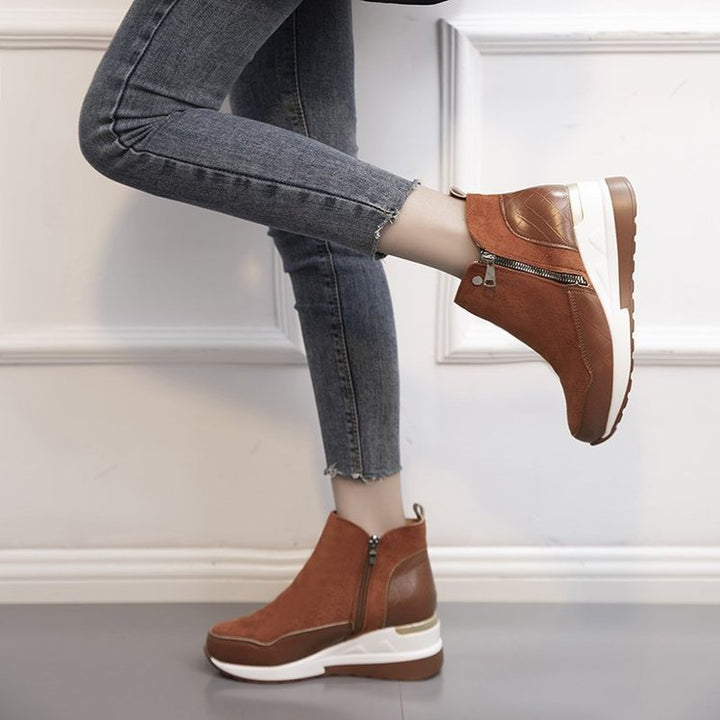 Close-up on the sole of orthopedic mid-top sneakers, revealing shock-absorbing technology & advanced comfort design.