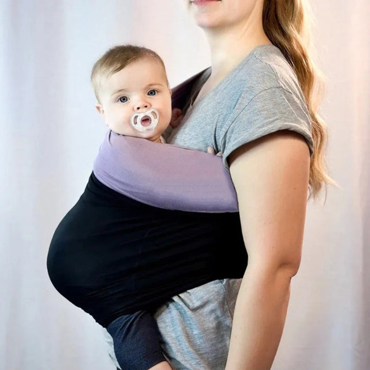 Comfortable SnugCarry baby wrap for hands-free support, ergonomic design for parent and baby.