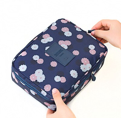 Compact waterproof toiletry and makeup bag, portable and durable for travel adventures.