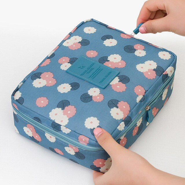 Unisex travel makeup organizer, waterproof, perfect for securely storing cosmetics and toiletries.