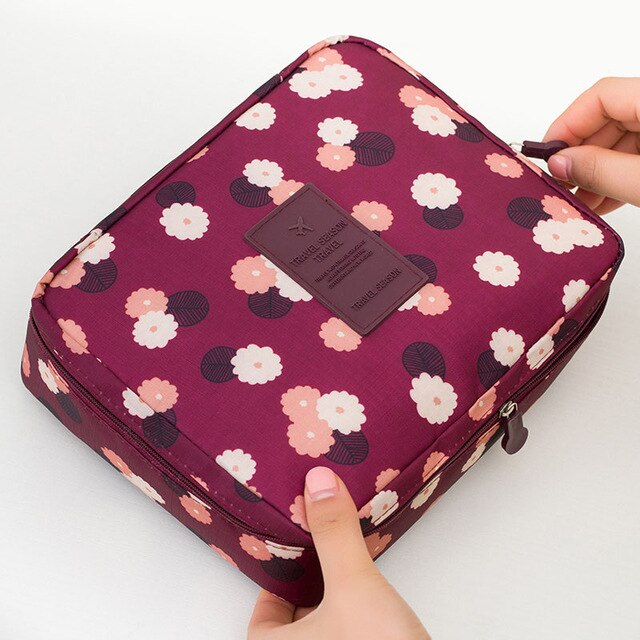 Compact waterproof cosmetic travel bag, portable and durable, with bonus mini case included.