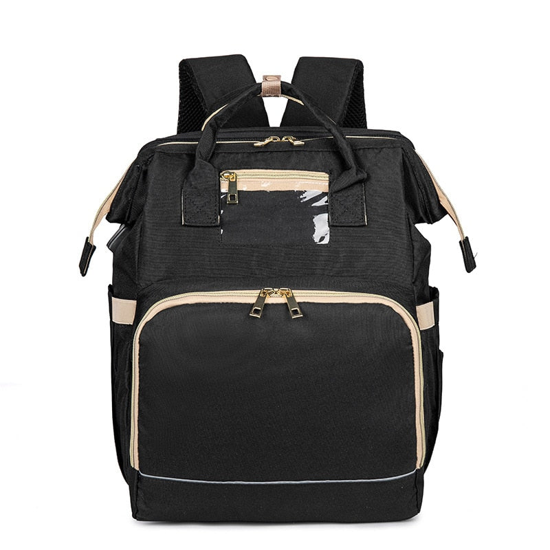 Stylish grey baby nappy backpack open to show large multi-pocket interior and pop-out bassinet