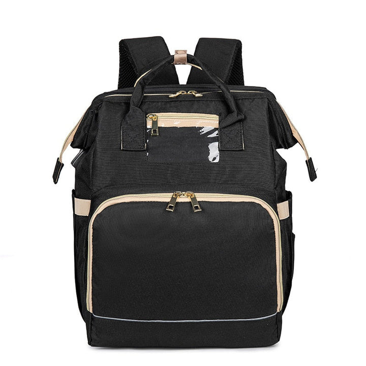 Stylish grey baby nappy backpack open to show large multi-pocket interior and pop-out bassinet