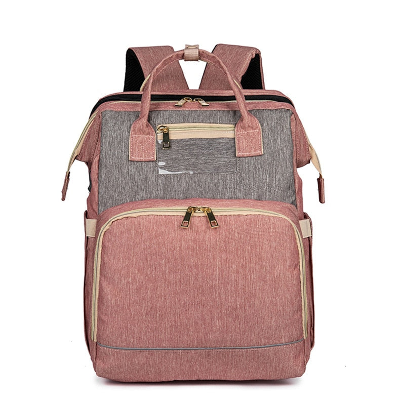 Close-up of the waterproof fabric and multi-pocket design on the convertible baby backpack