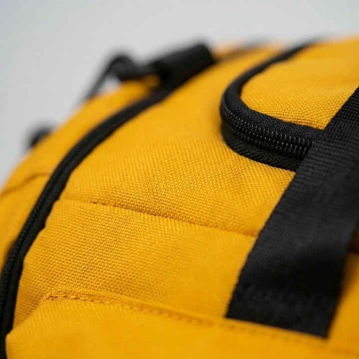 Rugged unisex convertible duffel backpack for sports, gym, & travel. Features multiple pockets & durable design.