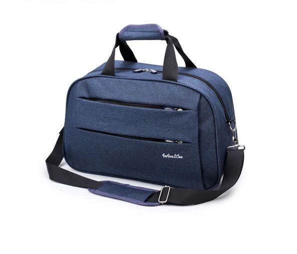 Unisex carry-on duffel bag positioned on a luggage rack, ready for a trip