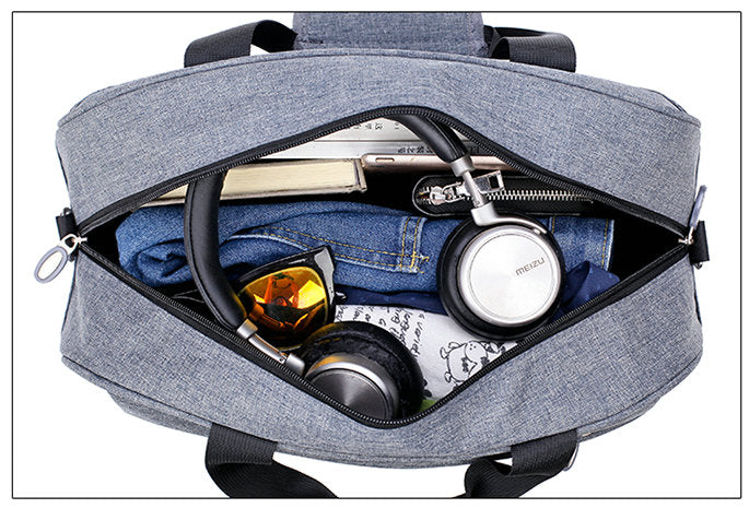 Unisex travel bag worn as a shoulder bag, demonstrating versatility and comfortable fit