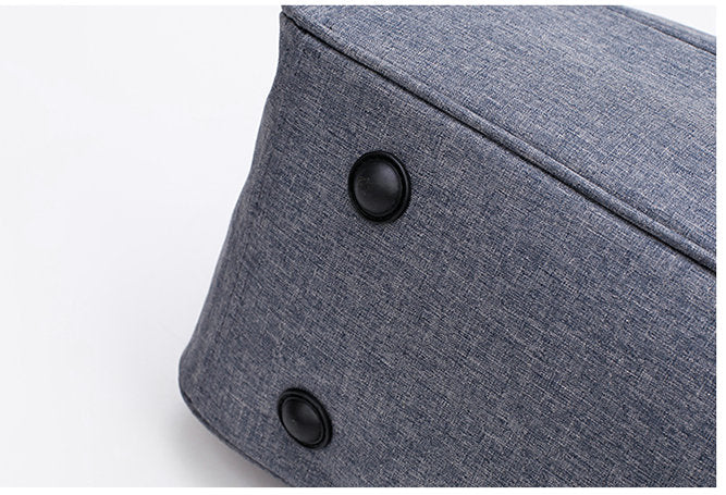 Water resistant travel accessory, close-up of durable fabric and zippers, black finish