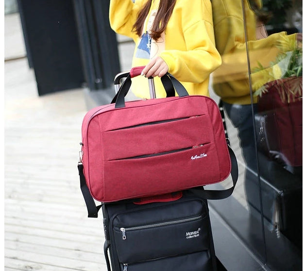 Spacious unisex carry-on bag interior, organized with mesh pockets for travel essentials