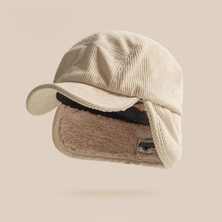 Cozy earflap winter cap, covers ears from cold, stylish unisex headwear for outdoor activities.