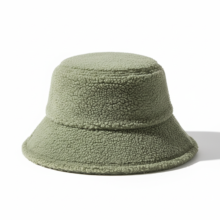 Fashionable fleece winter hat in an earthy green, a cozy and trendy fisherman style