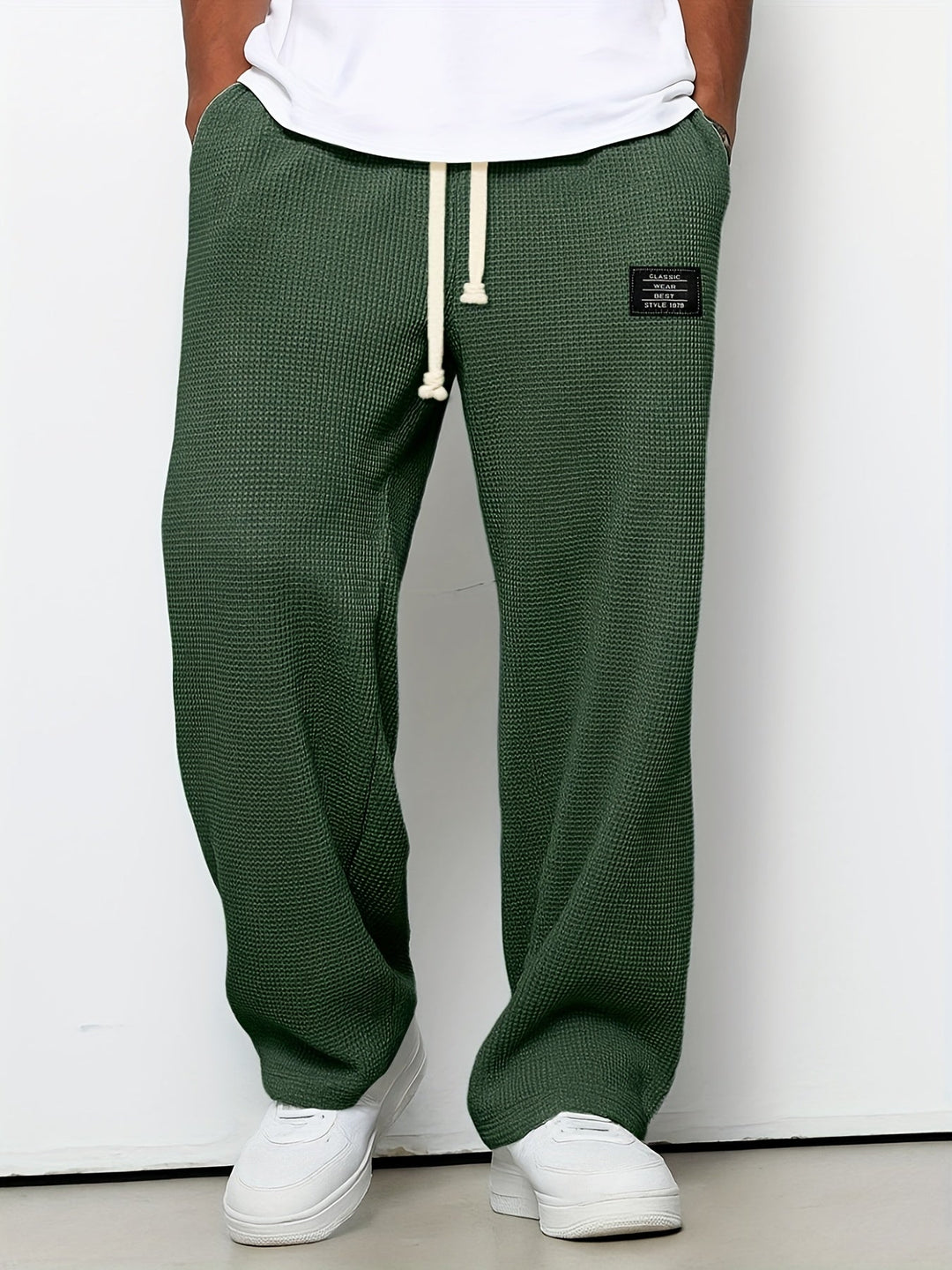 Cozy waffle knit unisex lounge pants with a relaxed wide-leg design and adjustable drawstring waist.