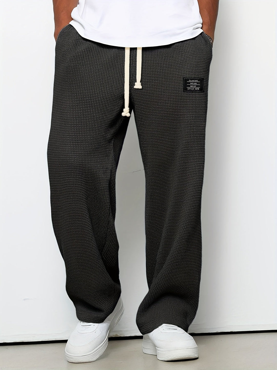 Soft fabric unisex waffle lounge pants with a wide leg and adjustable drawstring for ultimate comfort.