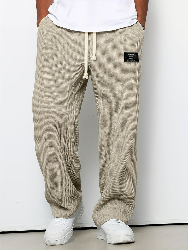 Relaxed fit unisex waffle knit pants, ideal for lounging and casual wear, featuring a comfortable design.