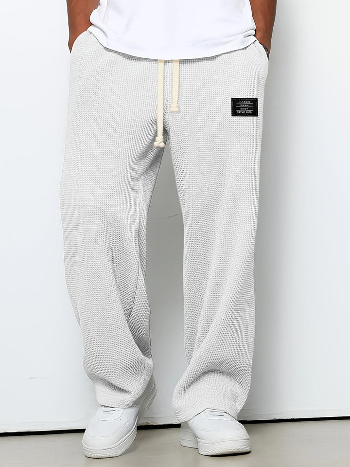 Comfortable unisex waffle weave lounge pants, soft and breathable, perfect for at-home relaxation.