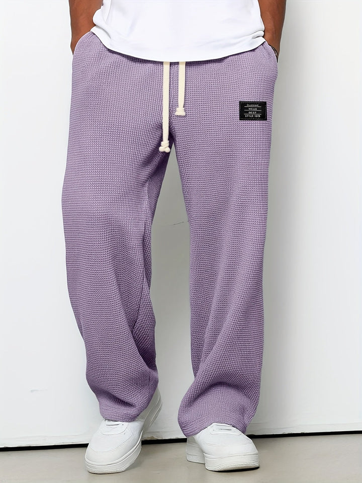 Soft, comfortable unisex waffle lounge pants. Relaxed fit design ensures ultimate leisure and style.