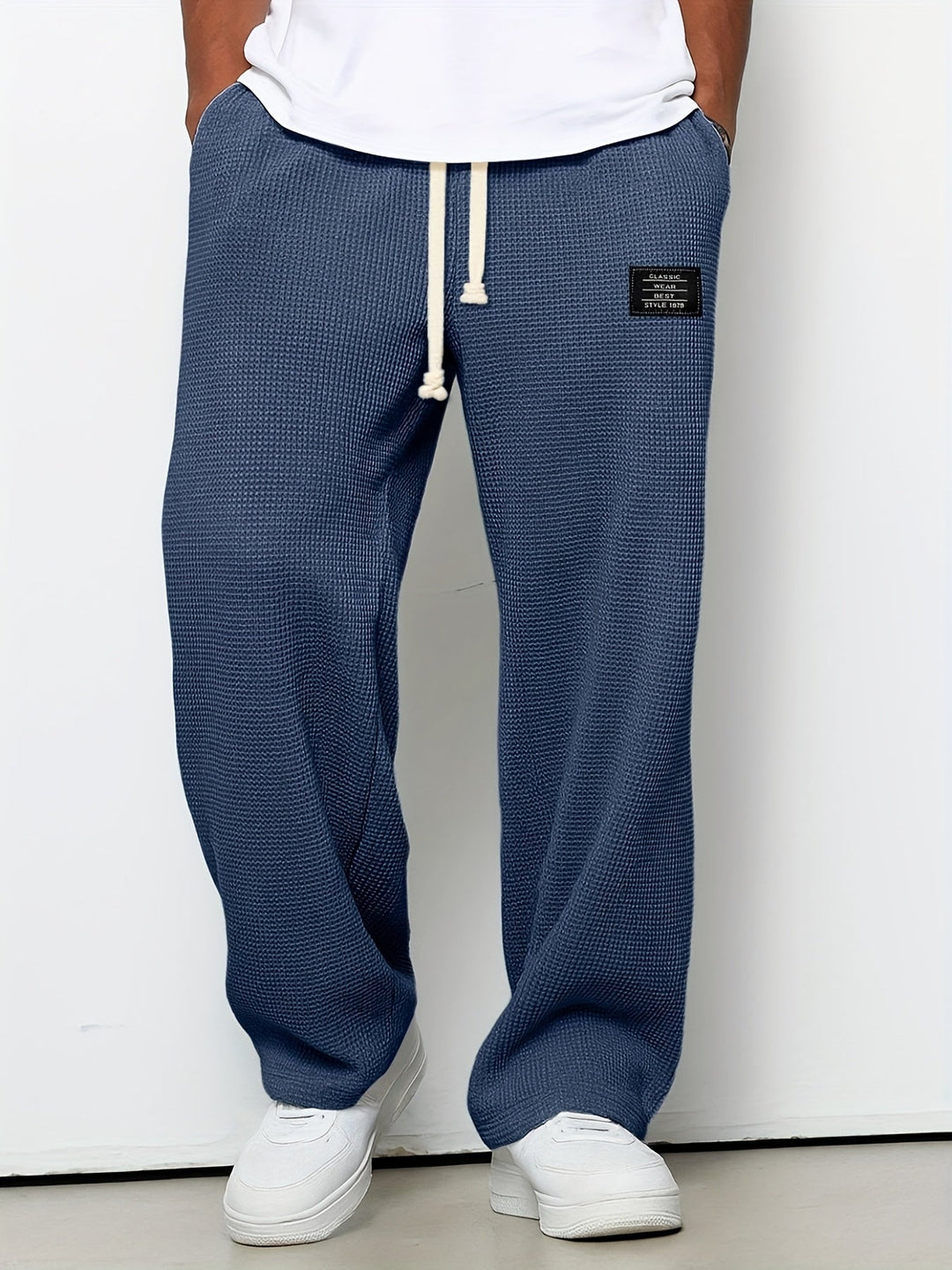 Casual wear unisex lounge pants, waffle knit texture, offering a relaxed wide leg and supreme comfort.