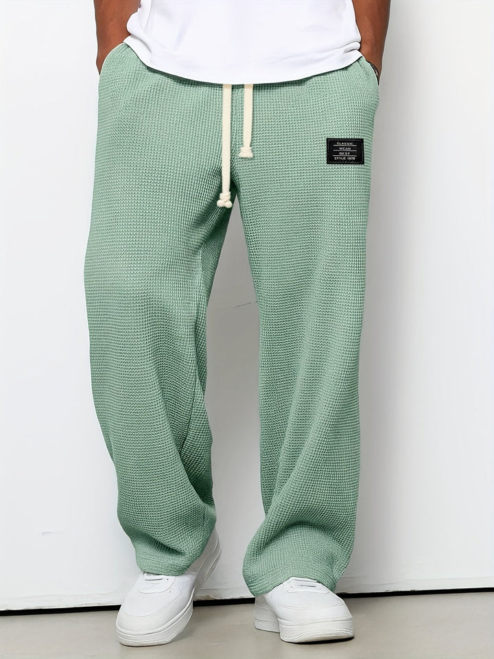 Stylish unisex relaxed fit waffle knit pants for lounging. Soft, comfortable, and perfect for home.