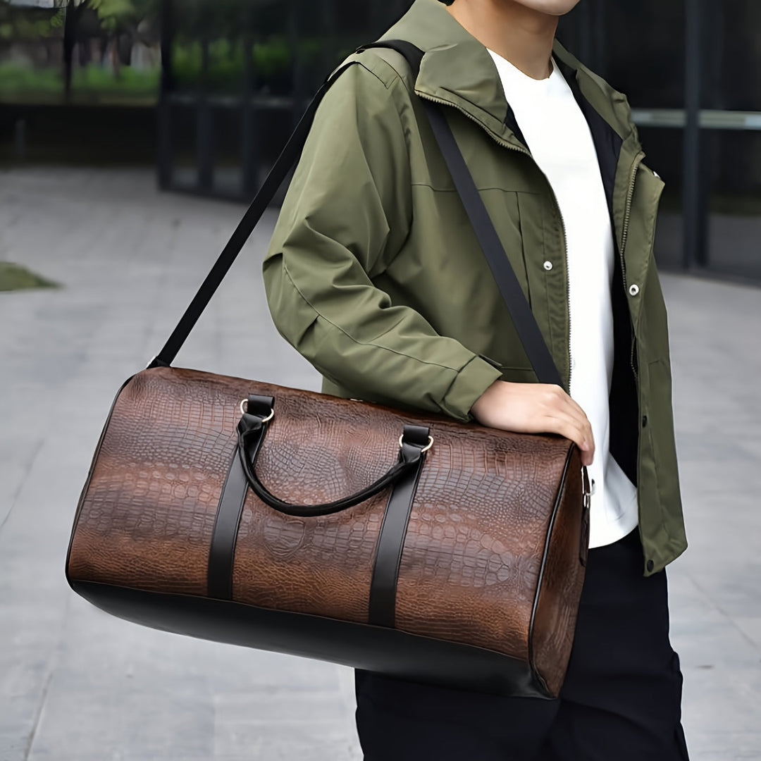 Waterproof & scratch-resistant croc-embossed vegan leather weekender for travel. Unisex duffle bag carry-on.