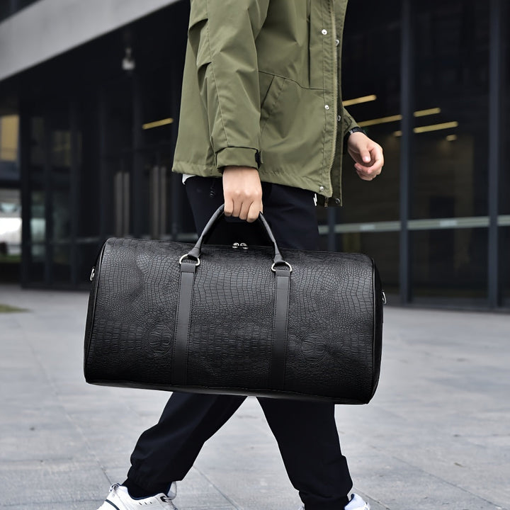 Spacious croc-embossed vegan leather duffle bag for gym or travel. Unisex weekender, scratch-resistant.