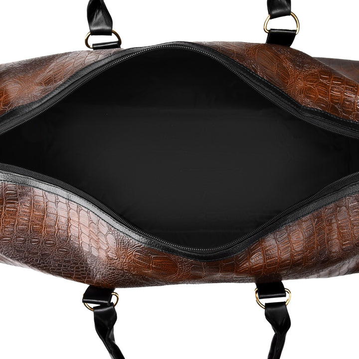 Unisex croc-embossed vegan leather duffle bag on a train platform. Stylish weekender, ideal carry-on.