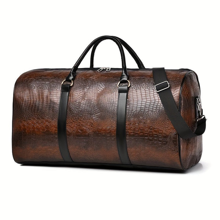 Close-up of croc-embossed vegan leather texture on a unisex weekender duffle bag. Waterproof travel accessory.
