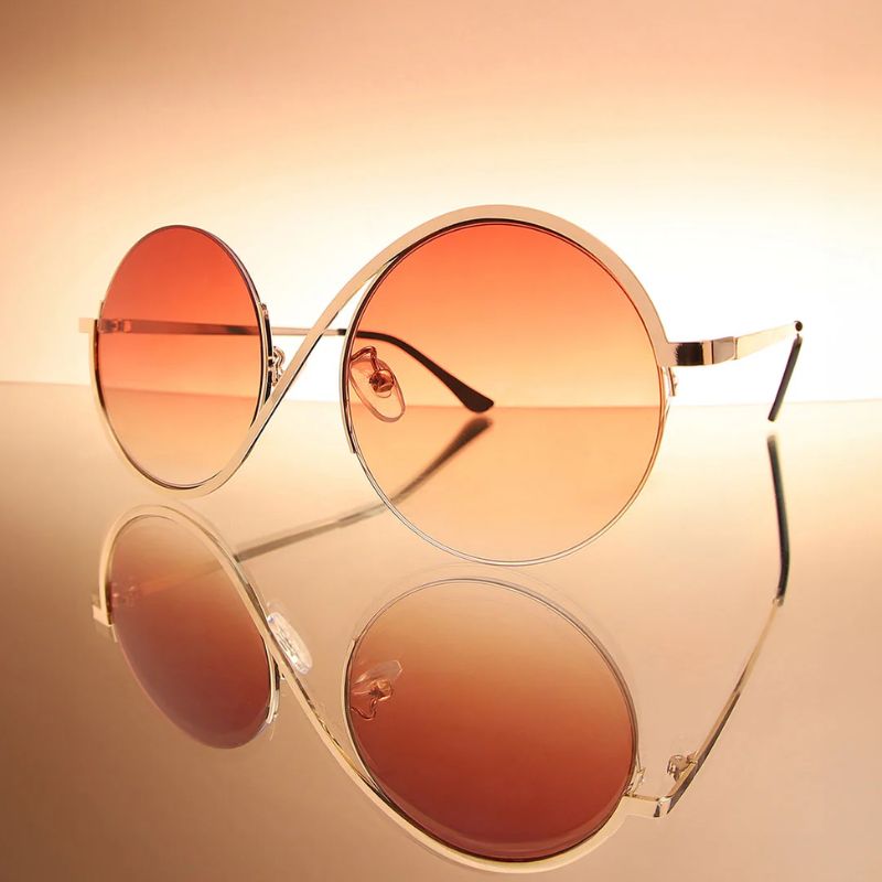 Stylish orange curved frame unisex sunglasses for fashion-forward individuals, providing essential UV protection.