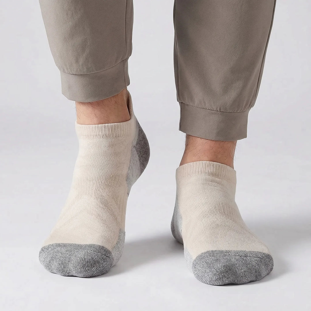 5-pack of unisex cushioned no-show ankle socks. Durable athletic socks for running, hiking, and active lifestyle.
