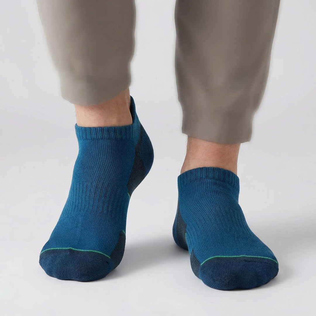 Close-up of a pair of cushioned no-show ankle socks. Enhanced support & comfort for all your active adventures.