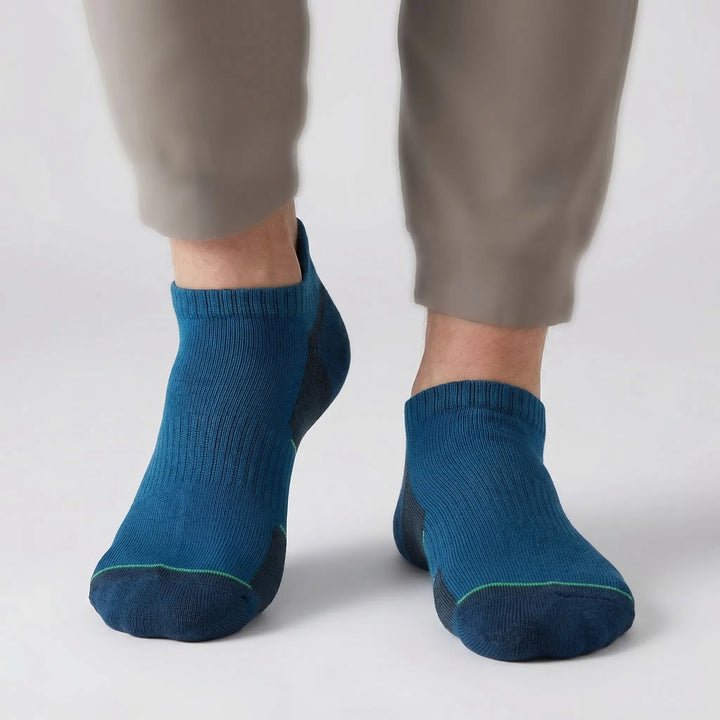 Close-up of a pair of cushioned no-show ankle socks. Enhanced support & comfort for all your active adventures.