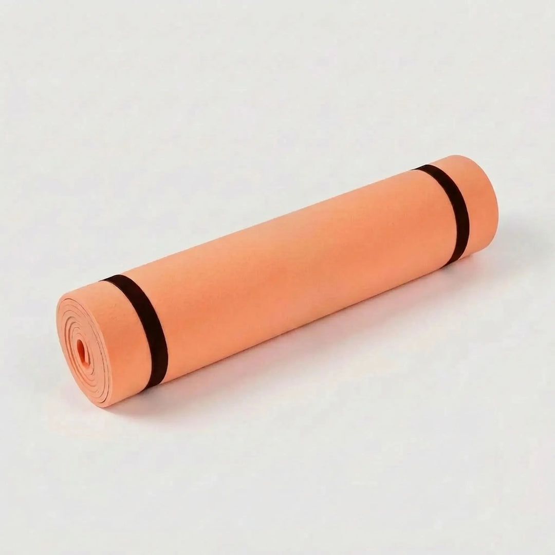 Durable yoga mat, cushioned & non-slip, essential for pilates, fitness, & floor exercises in your home gym.