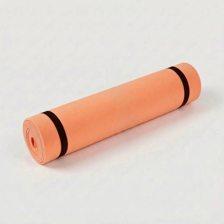 Durable yoga mat, cushioned & non-slip, essential for pilates, fitness, & floor exercises in your home gym.
