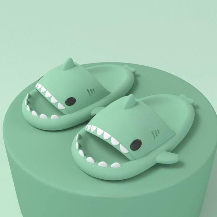 Close-up of the textured non-slip sole of a cushioned shark slide sandal, soft and lightweight