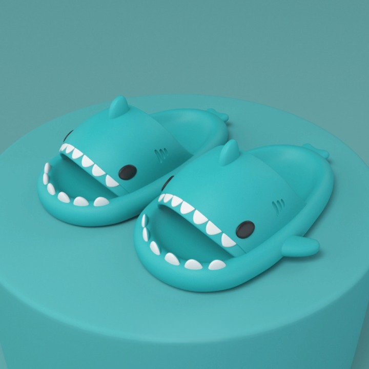 Young person wearing cushioned shark slide sandals, showcasing their lightweight & comfy design