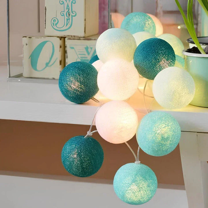 USB string lights with fabric cotton balls, providing versatile power options for home decor.